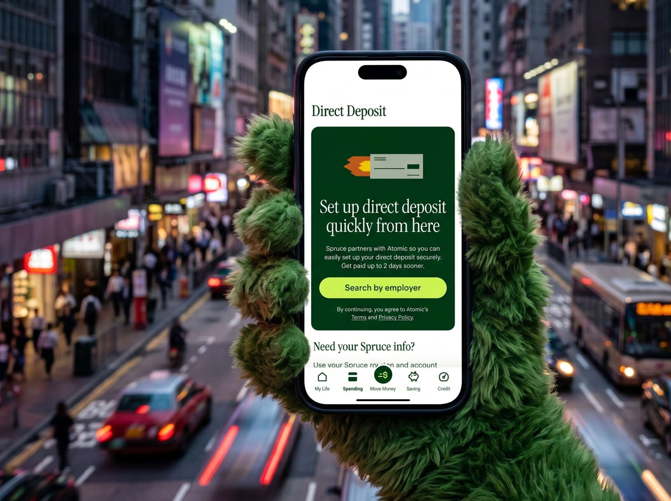 Spruce Direct Deposit screen held in city street